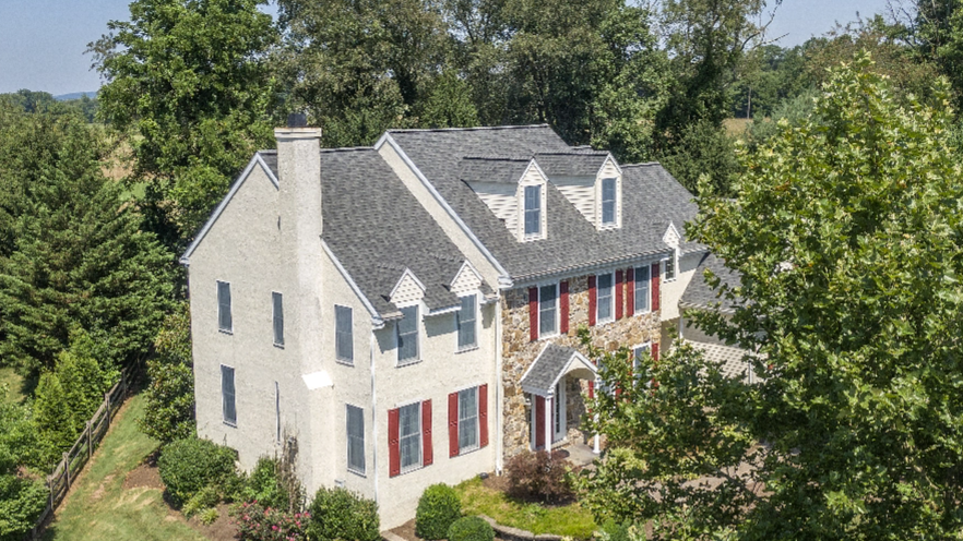 White Home With stone accents