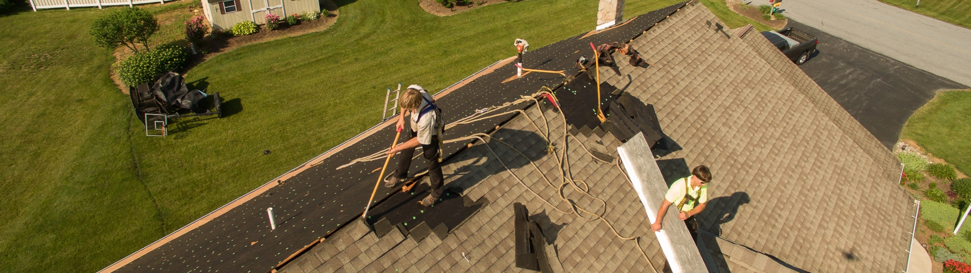 Close up, overhead view of the Middle Creek Roofing Crew working on a roof.