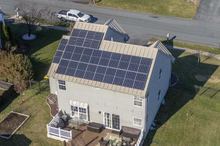 Overhead view a new roof on a home with solar panels courtesy of Middle Creek Roofing