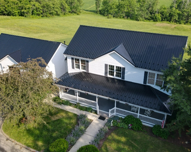 Overhead view of a new metal roof replacement on a two story home with a covered deck in Southeastern PA courtesy of Middle Creek Roofing 