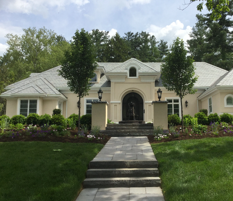 Large home with lush front yard, fountain and newly replaced slate roof