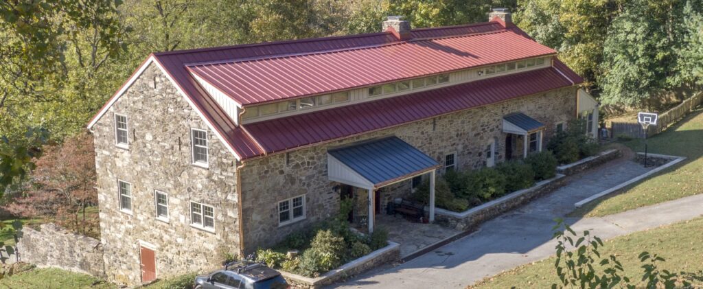 Stone Home With New Standing Seam Metal Roof