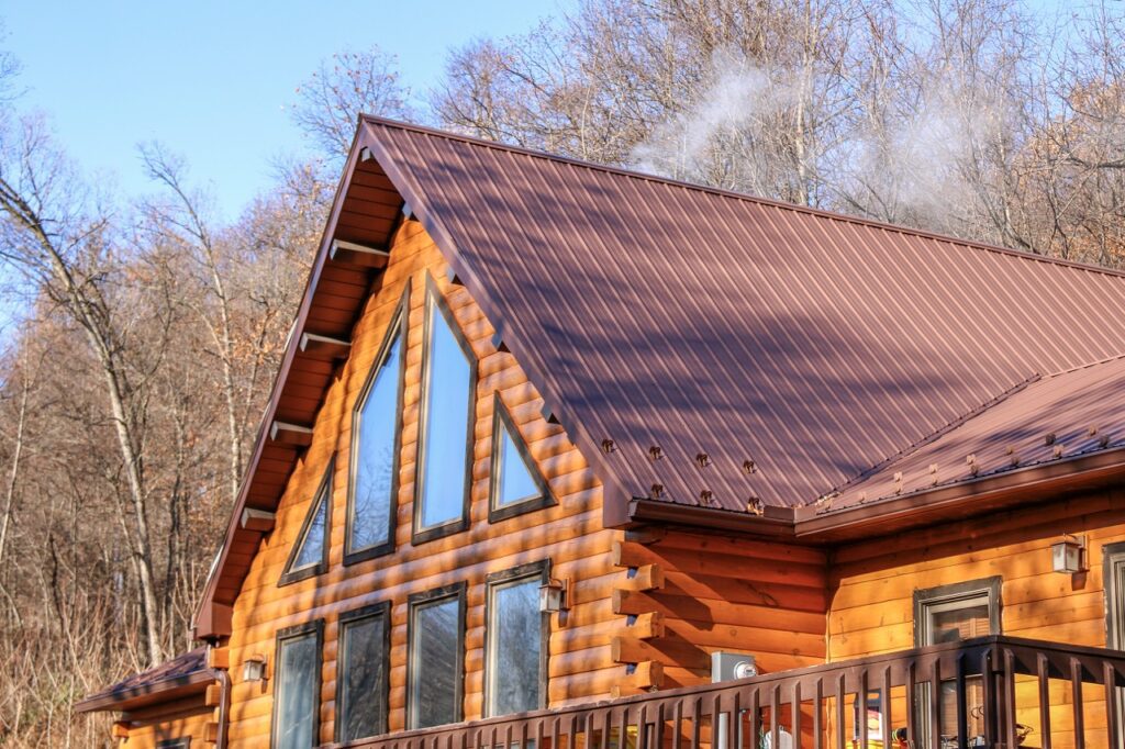 maroon metal roof on a log cabin