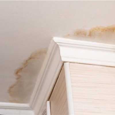 Ceiling spots inside residential home show signs that you need a new roof